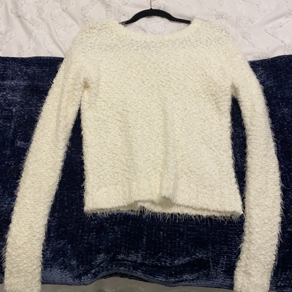 White puffy sweater